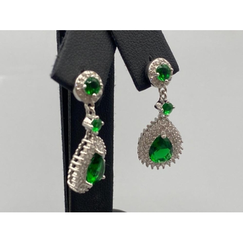 87 - A pair of silver CZ and faux emerald drop earrings, 4.8g