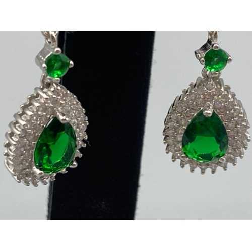 87 - A pair of silver CZ and faux emerald drop earrings, 4.8g