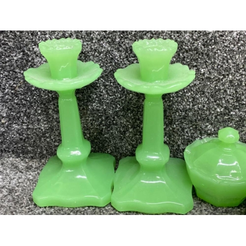 395 - Uranium glass dressing table set of candlesticks, ring holder, 2 small & 1 large lidded pots