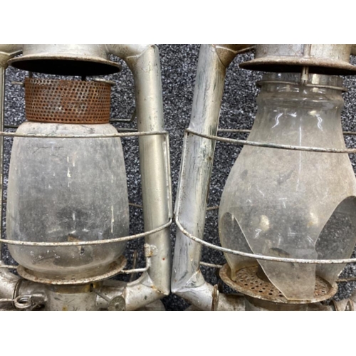 398 - A large pair of hurricane oil lamps