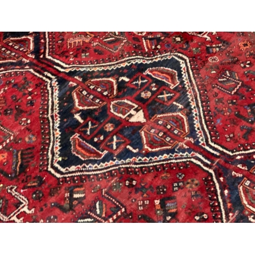 630 - Large fringed eastern carpet 297x221cm