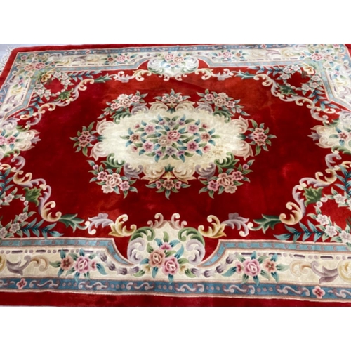 629 - Large fringed Chinese carpet, 853x225cm