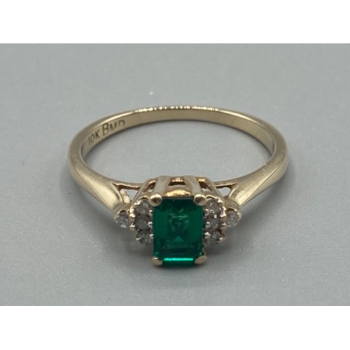 106 - Ladies 9ct yellow gold green stone and diamond ring size O 2.2g gross