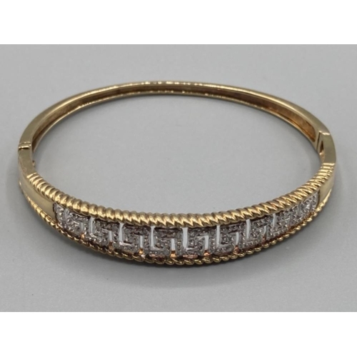 121 - Ladies 9ct yellow gold and diamond bangle approx .25ct 14.3g gross