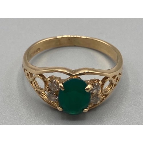 129 - Ladies 18ct yellow gold green and white stone ring size Q 3.3g gross