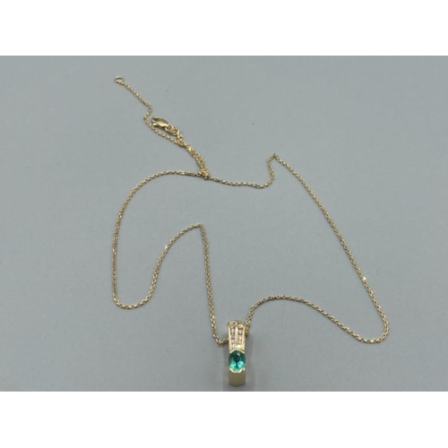 134 - Ladies 14ct yellow gold emerald and diamond pendant and on 9ct gold chain 6.6g gross