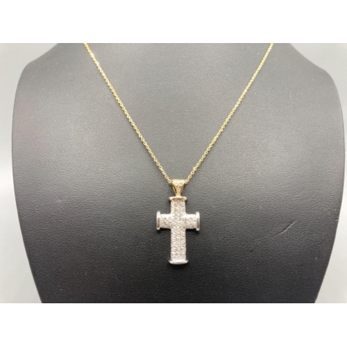 144 - Ladies 9ct white gold and diamond set crucifix on 9ct gold chain (24.5cm long) 5.5g gross