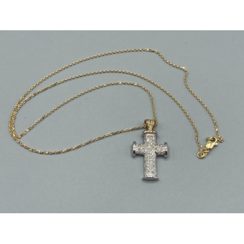 144 - Ladies 9ct white gold and diamond set crucifix on 9ct gold chain (24.5cm long) 5.5g gross