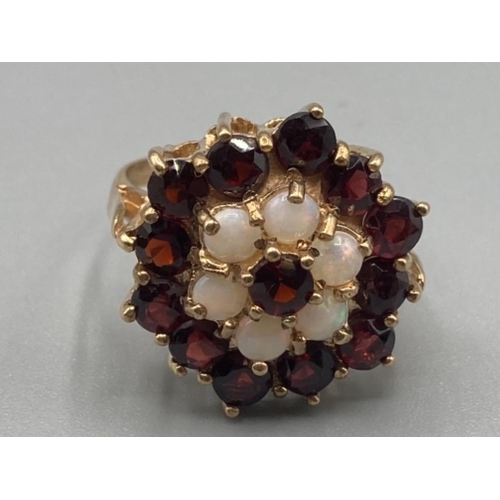 146 - Ladies 9ct yellow gold garnet and opal cluster ring size M 5g gross