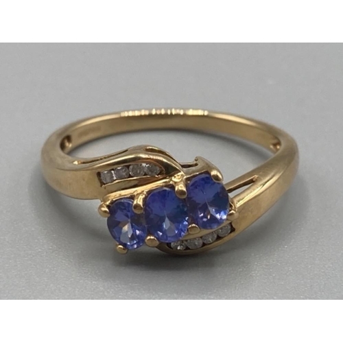 153 - Ladies 9ct yellow gold tanzanite and diamond ring size M 2.5g gross