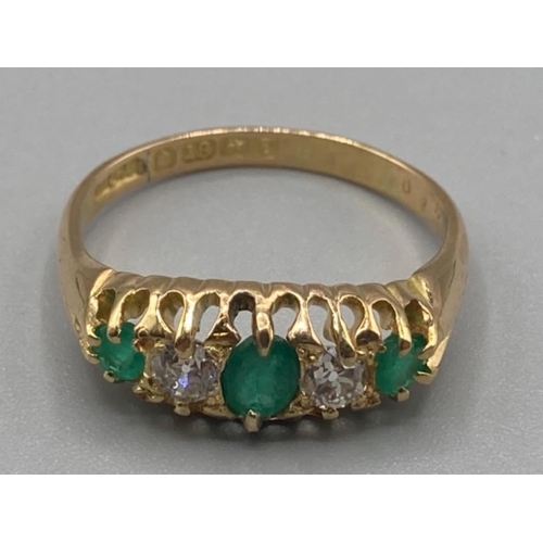 155 - Ladies 18ct yellow gold emerald and diamond five stone ring size Q 3.8g gross