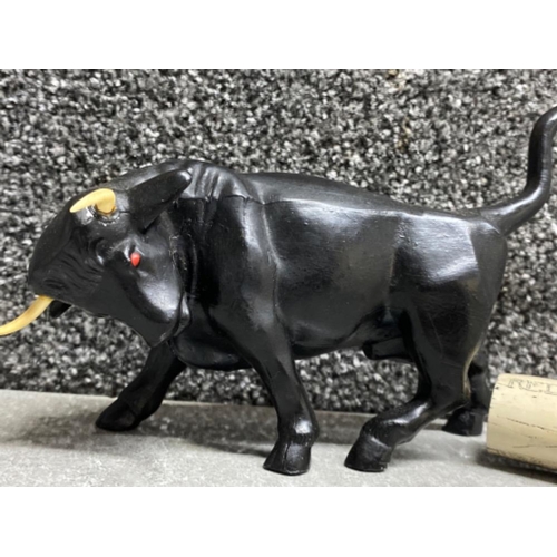 180 - Heavy metal fighting bull ornament together with a vintage corkscrew with resin scrimshaw design han... 