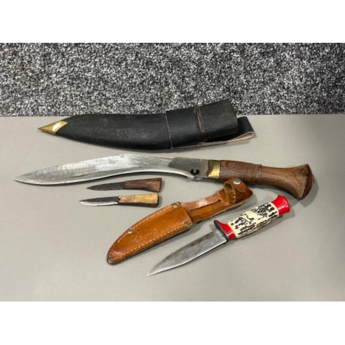 202 - Kukri knife and sheath with 2 small knives along with Soligen knife