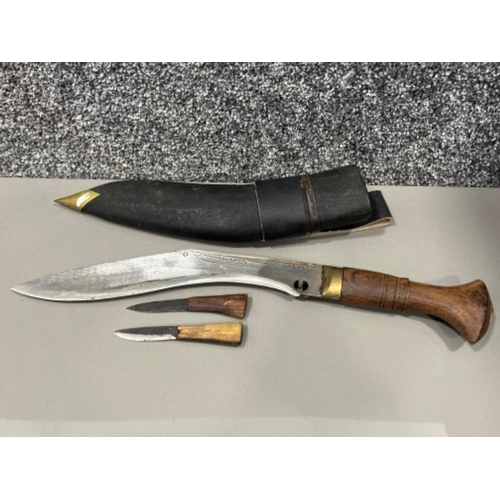 202 - Kukri knife and sheath with 2 small knives along with Soligen knife