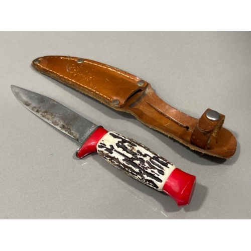 202 - Kukri knife and sheath with 2 small knives along with Soligen knife