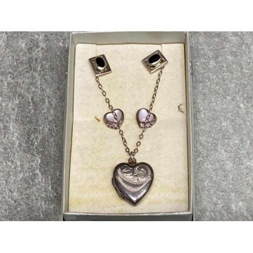 265 - Silver heart shaped locket and chain plus 2 pairs of silver stud earrings, 8.5G