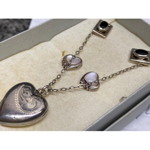 265 - Silver heart shaped locket and chain plus 2 pairs of silver stud earrings, 8.5G