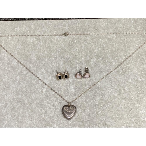 265 - Silver heart shaped locket and chain plus 2 pairs of silver stud earrings, 8.5G