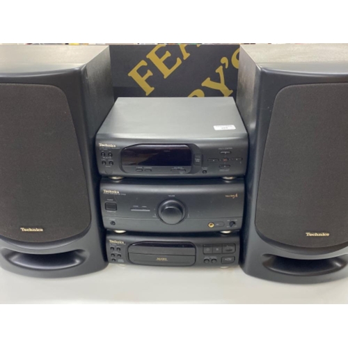 289 - Technics stacking system includes tuner/sound processor ST-CH505, stereo amplifier SE-CH404 and a Co... 