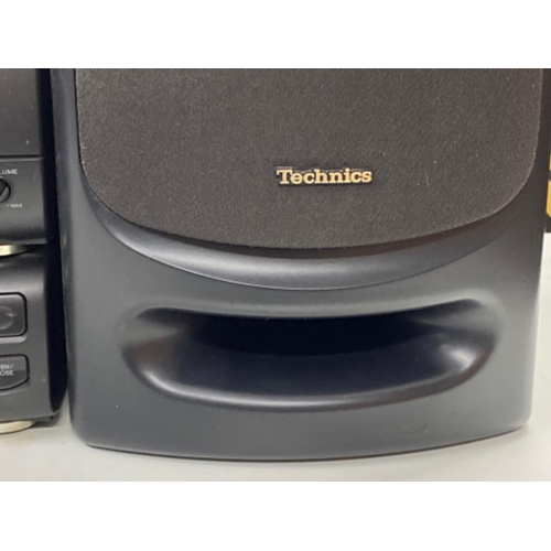 289 - Technics stacking system includes tuner/sound processor ST-CH505, stereo amplifier SE-CH404 and a Co... 