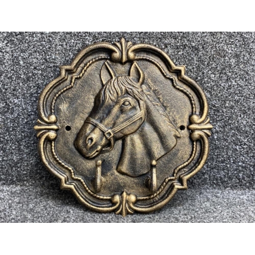 372 - Cast metal hanging coat rack with horses head design