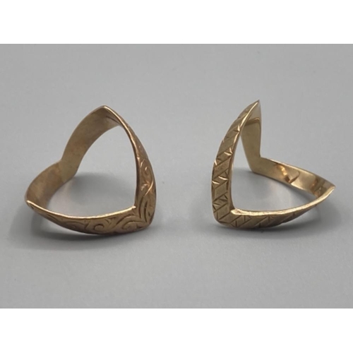 473 - Two 9ct yellow gold wishbone rings silver, one fully engraved size N 2.5g, and the other half engrav... 