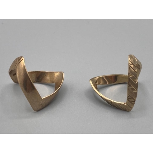 473 - Two 9ct yellow gold wishbone rings silver, one fully engraved size N 2.5g, and the other half engrav... 