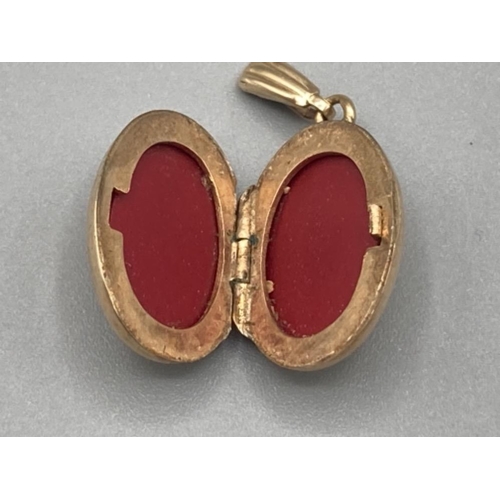 485 - 9ct gold oval locket 2.4g gross