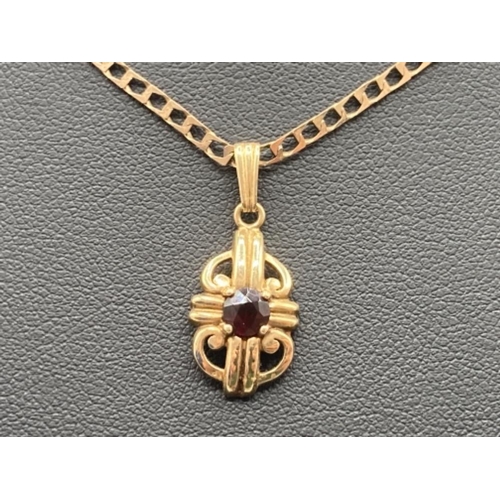 489 - 9ct gold garnet set pendant on flat square link chain 4.6g 51cm long