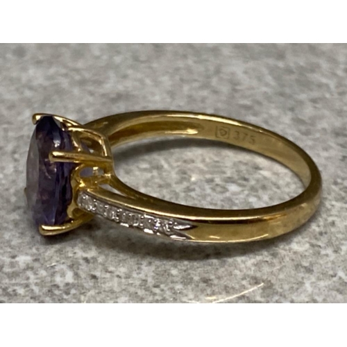 550 - 9ct yellow gold purple amethyst & 8x diamond ring - size L, 2g gross