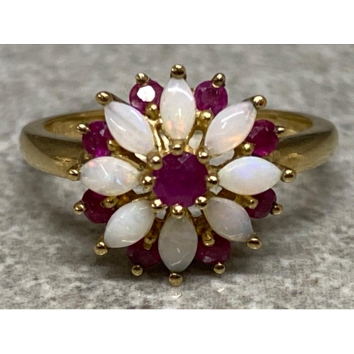 551 - 9ct yellow gold Opal & Ruby ring (flower design) size L, 2.6g gross