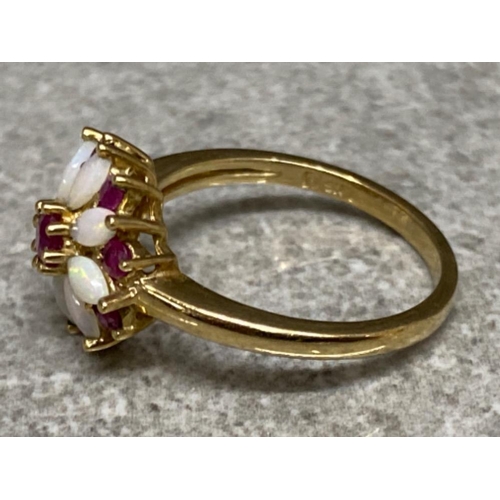 551 - 9ct yellow gold Opal & Ruby ring (flower design) size L, 2.6g gross