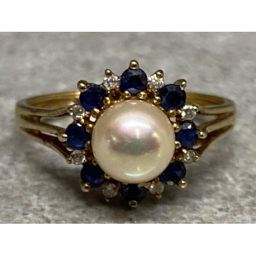 553 - 9ct yellow gold sapphire, diamond & Pearl ring, comprising of 8x diamonds & 8x sapphires all surroun... 