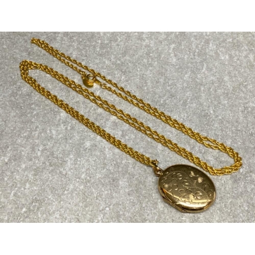 565 - Large hallmarked 9ct yellow gold locket 10.5ct, on gilt metal chain