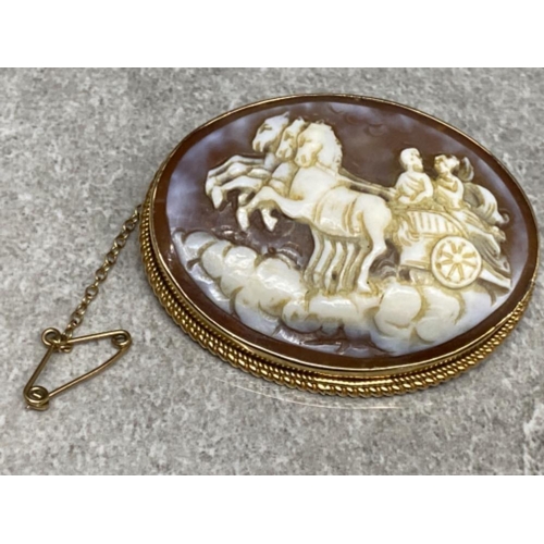 567 - Large Victorian 9ct gold framed cameo brooch (chariot design) with safety chain, 14.8g gross, 5x3.5c... 