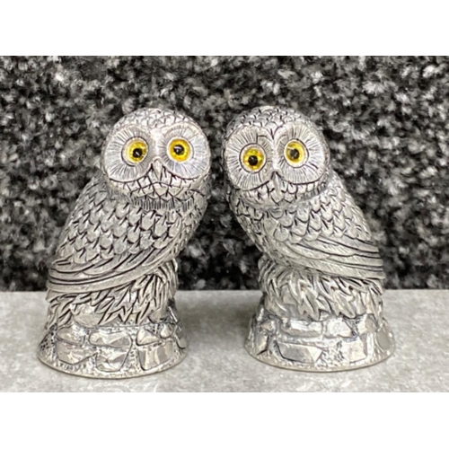 574 - A pair of owl condiments with glass eyes stamped 800, 100.2g