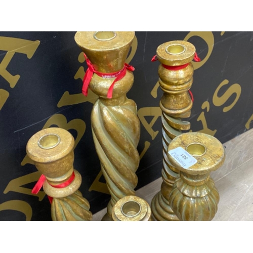 581 - 5x large gilt resin candlesticks (different styles & sizes, largest being 41cm)