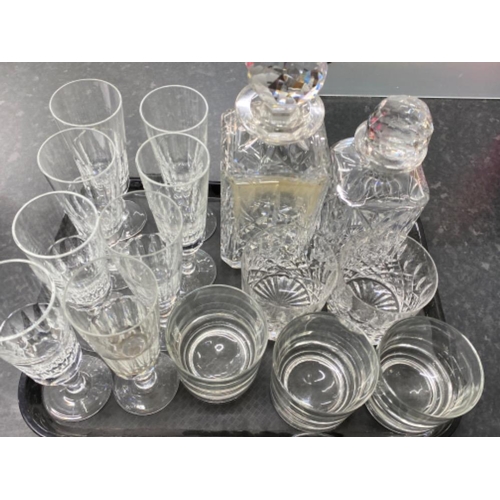 586 - Tray of crystal glass including 2x decanters with stoppers, flutes & whisky tumblers