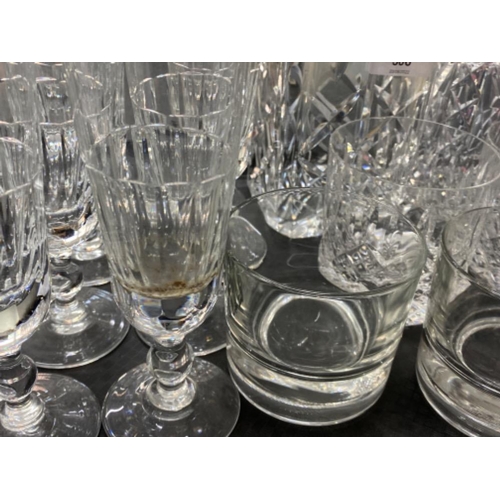 586 - Tray of crystal glass including 2x decanters with stoppers, flutes & whisky tumblers