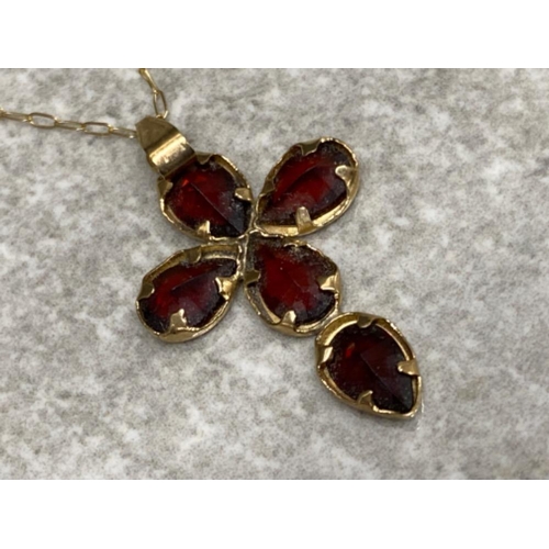 63 - 9ct yellow gold & 5 stone garnet crucifix pendant on 9ct gold chain, 1.1g gross