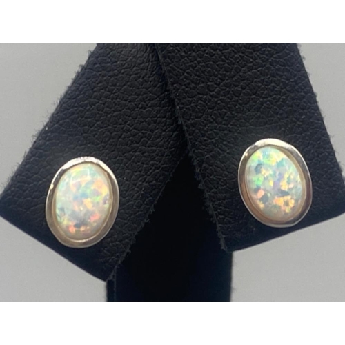 70 - A pair of silver and opal stud earrings, 1.1g