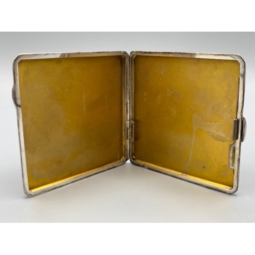 75 - A silver case with enamel plaque depicting a semi naked female