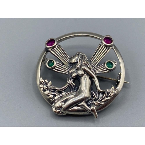 84 - A silver art nouveau style fairy brooch set with ruby and emerald cabochons, 9.8g