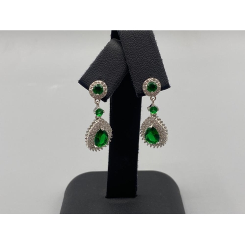 87 - A pair of silver CZ and faux emerald drop earrings, 4.8g