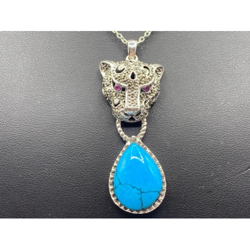 88 - A substantial silver leopards head pendant necklace with turquoise drop, 12.9g