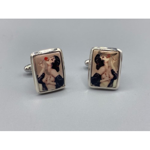 92 - A pair of silver and enamel cufflinks with semi nude figures, 11.5g