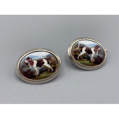 93 - A pair of silver and enamel set of cufflinks depicting a dog, 9.0g