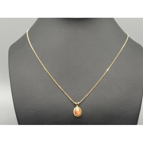 96 - Ladies 9ct yellow gold coral pendant and chain (23cm long) 2.4g gross