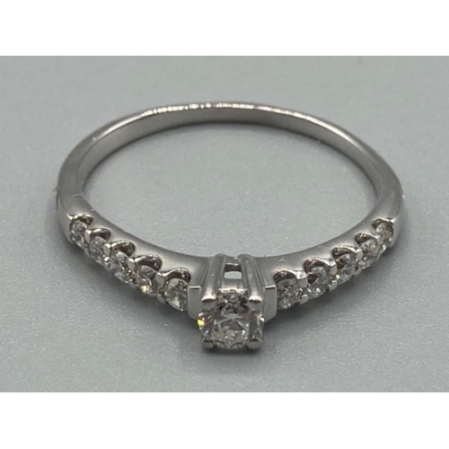 98 - Ladies 18ct white gold diamond ring with five diamonds set on each shoulder size Q 2.5g gross