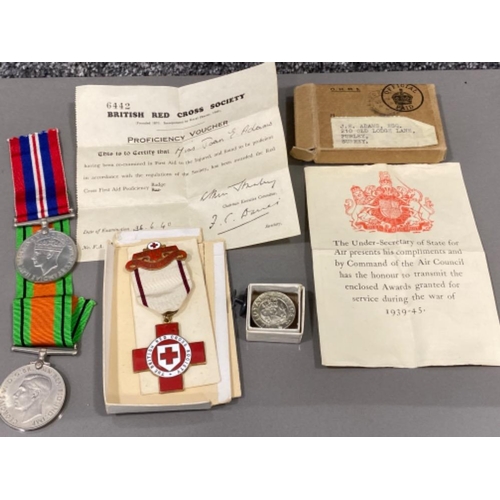 14 - WWII medals & paperwork includes the British Red Cross society, defence medal & war medal, all with ... 